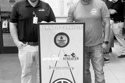 Nathan Coulter (left) and Chris Wassana presented the program at the Seminole Lions Club on Tuesday and explained the rules of Cornhole